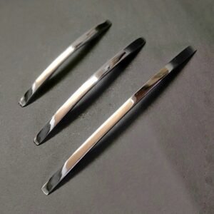 stainless steel pull handles set of three with a polished chrome finish, placed parallel on a dark background.