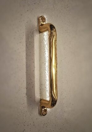 Image (16) Classic gold-finished tubular pull handle with rounded ends and two mounting plates, designed for a timeless and elegant look.