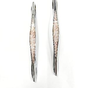 steel finish door pull handles with a decorative textured center in white and gold accents, displayed on a white background