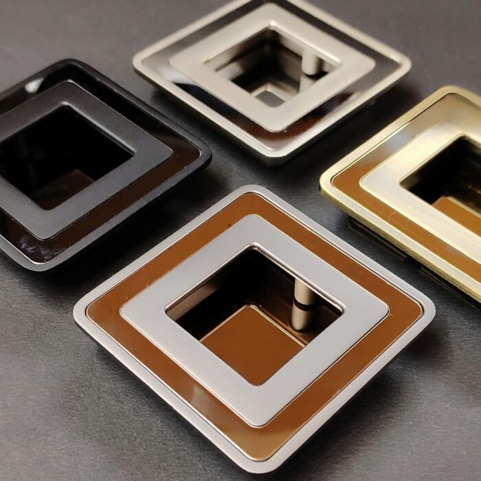 1 (44) Set of four square recessed cabinet pull handles in black, silver, bronze, and gold finishes, placed on a dark background.