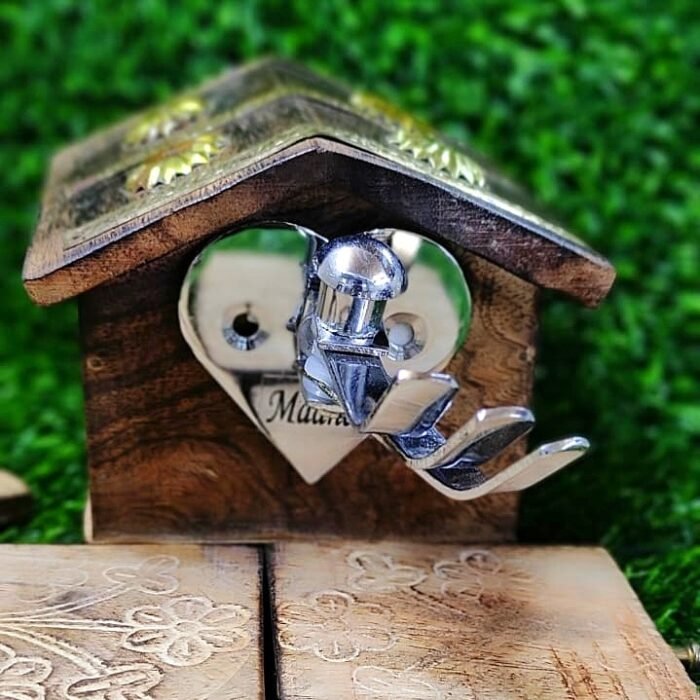 Chrome finish stainless steel heart shaped multi hook wall hanger mounted on wooden base, ideal for keys, clothes, and accessories.