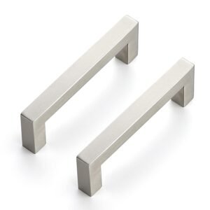 Pair of modern stainless steel square bar pull handles with a brushed finish, mounted vertically on a light-colored textured surface.