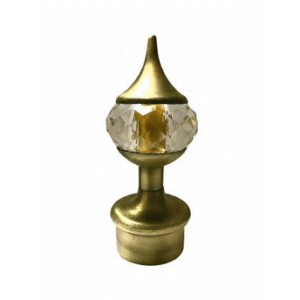 Golden curtain rod finial with crystal centerpiece and pointed top for elegant home décor.