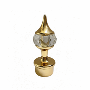 Golden curtain rod finial with crystal centerpiece and pointed top for elegant home décor.